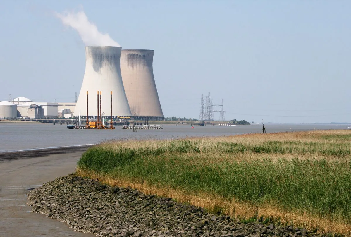 Cooling towers at a power plant beside a river