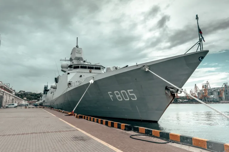 Naval ship docked at a harbour