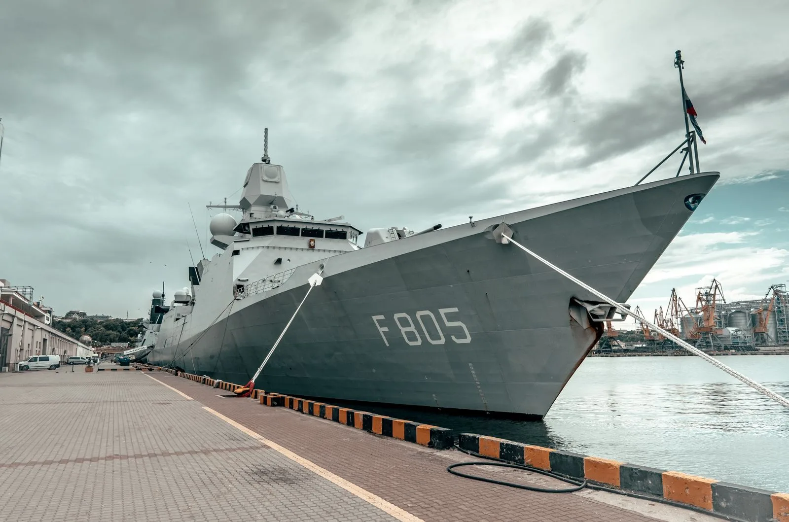 Naval ship docked at a harbour