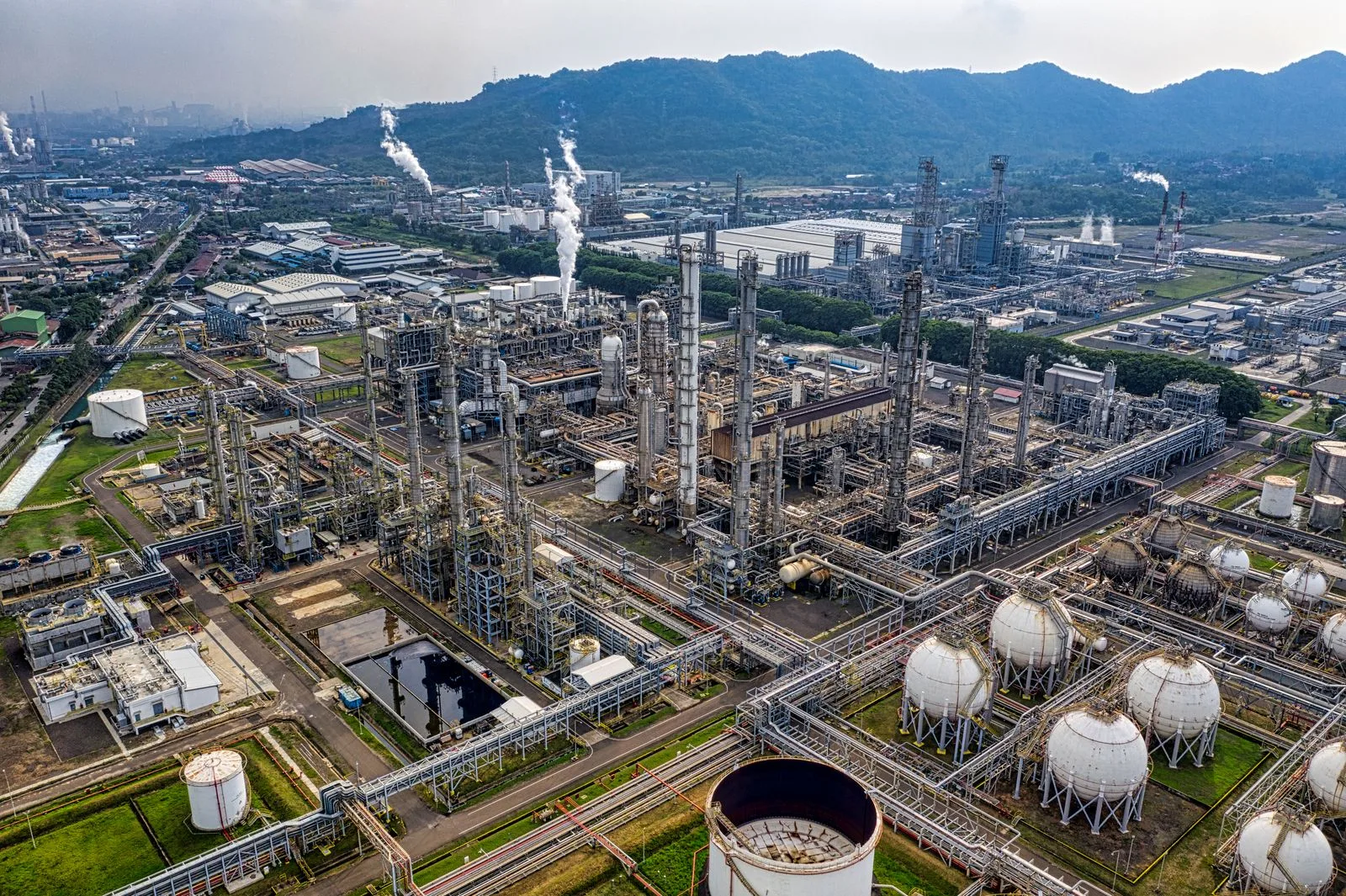 Aerial view of a petrochemical refinery with storage tanks